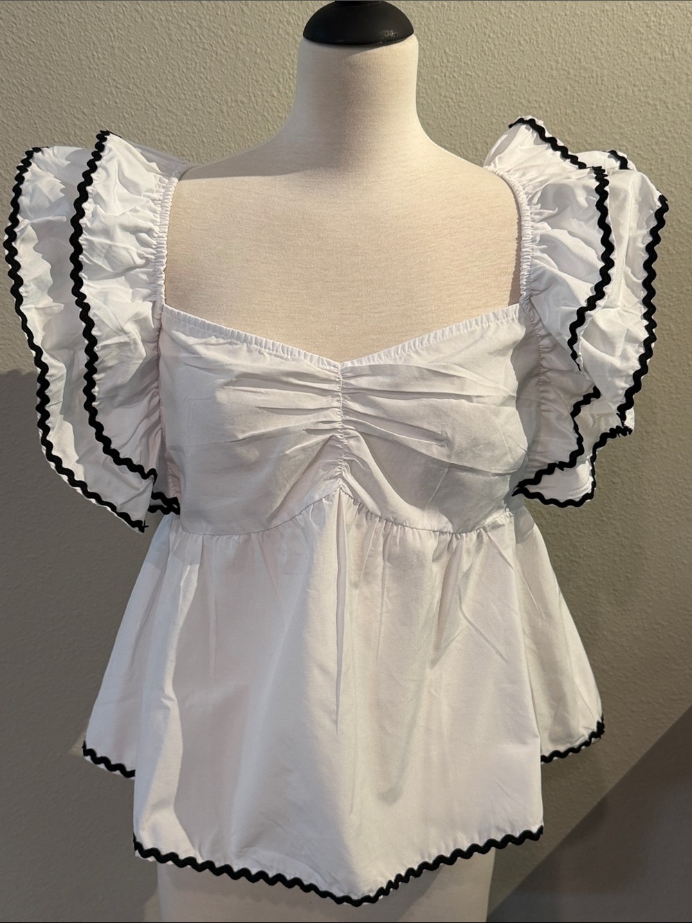 White Ruffle Sleeve Peplum Top with Contrast Trim